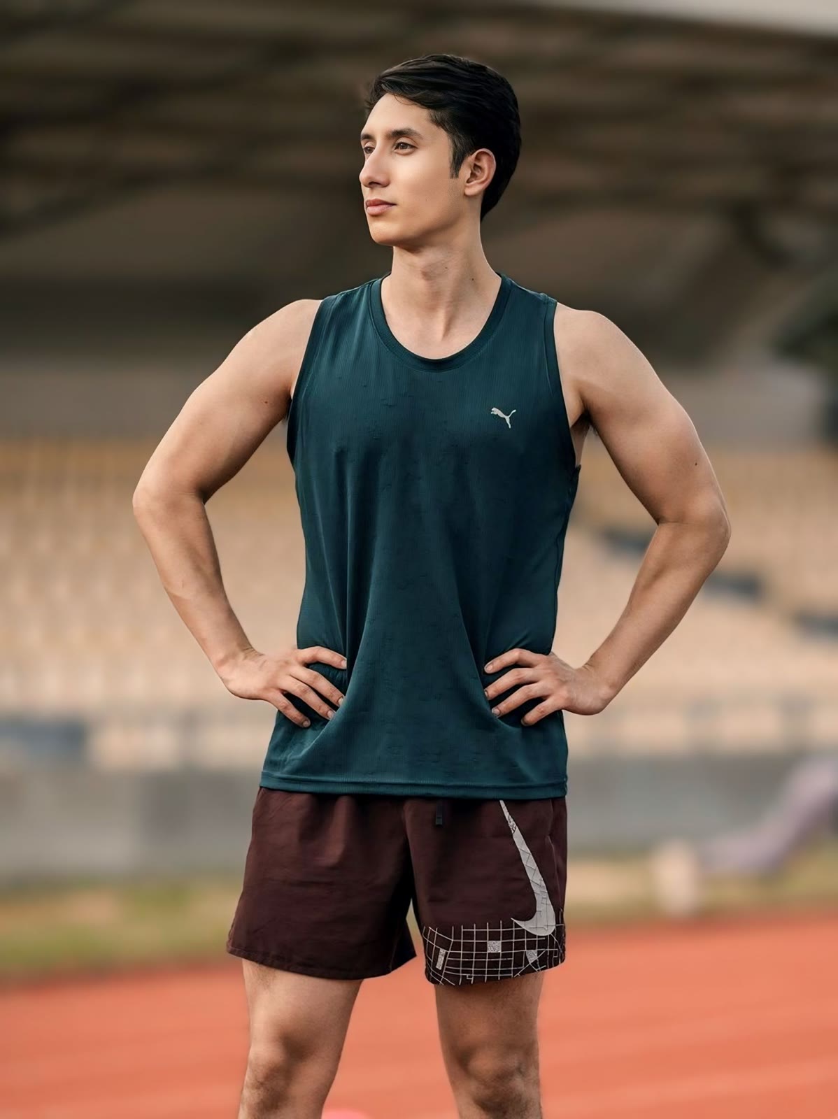 A focused athlete on a running track.