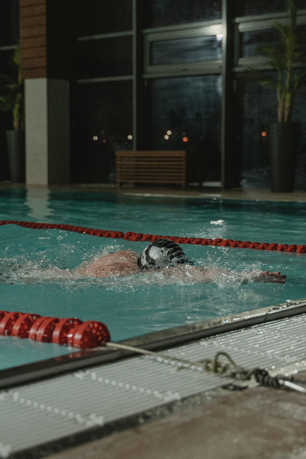 A swimmer training in an indoor pool.